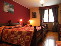 a lovely double room with a balcony overlooking the alps